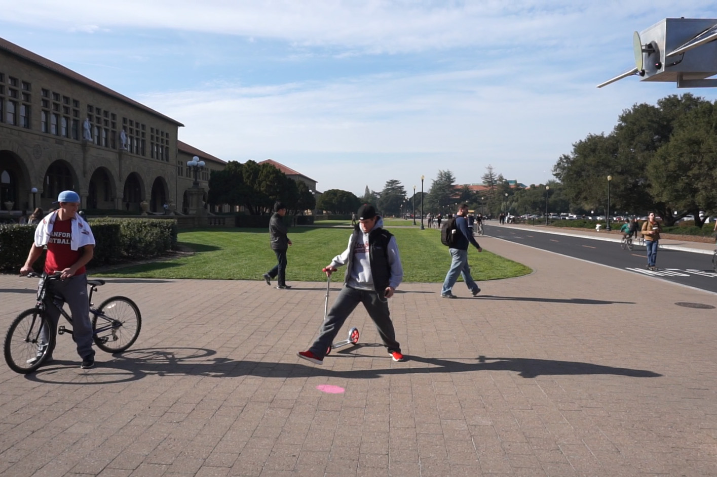 Two players volleying the pink spot